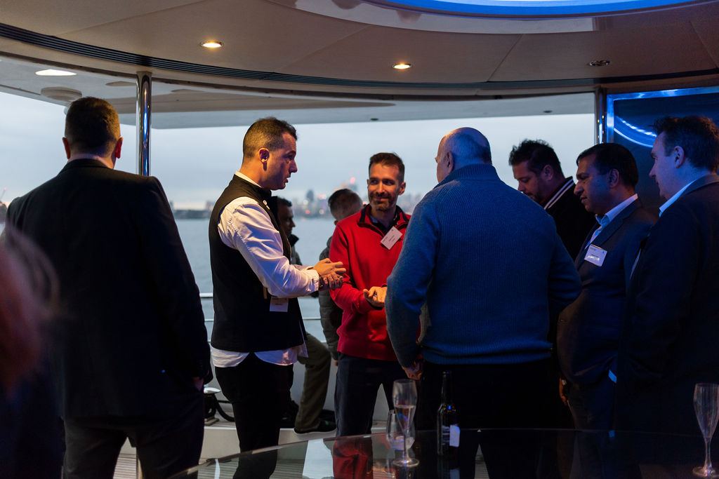 Executives networking at an Innovatus Media harbour event